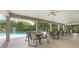 Spacious covered patio featuring tables and chairs, perfect for outdoor dining and relaxation at 11508 30Th E Cv, Parrish, FL 34219