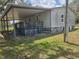 Exterior shot of home with large covered space perfect for outdoor entertaining at 13023 Taylor St, Brooksville, FL 34613