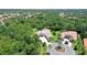 Overhead view of home highlighting its location amidst mature landscaping in an exclusive community at 13203 Lost Key Pl, Lakewood Ranch, FL 34202