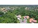 Aerial view of beautiful community featuring lush, mature landscaping, lakes, and golf course at 13203 Lost Key Pl, Lakewood Ranch, FL 34202