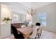 Elegant dining room featuring a decorative light fixture at 13203 Lost Key Pl, Lakewood Ranch, FL 34202