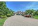 Charming home with a paver driveway and lush landscaping at 13203 Lost Key Pl, Lakewood Ranch, FL 34202