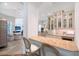 View of the kitchen bar, with granite counters, decorative cabinets, and seating at 13203 Lost Key Pl, Lakewood Ranch, FL 34202