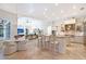 Open-concept kitchen boasts a large island with seating, stainless steel appliances, and ample counter space at 13203 Lost Key Pl, Lakewood Ranch, FL 34202