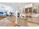 Bright kitchen featuring an island, stainless steel appliances, granite countertops, and a ceiling fan at 13203 Lost Key Pl, Lakewood Ranch, FL 34202