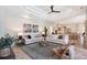Open-concept living room with contemporary decor, stylish furniture, and an open layout at 13203 Lost Key Pl, Lakewood Ranch, FL 34202