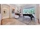 Living room with built-in bookshelves, fireplace, and grand piano at 13203 Lost Key Pl, Lakewood Ranch, FL 34202
