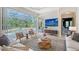 Living room view of the lanai and pool, with decorative rug, comfortable seating, and modern decor at 13203 Lost Key Pl, Lakewood Ranch, FL 34202