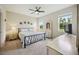Spacious carpeted bedroom featuring large windows for natural light and white painted furniture at 13804 Woodbridge Ter, Lakewood Ranch, FL 34211