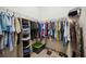 Walk-in closet features ample shelving, hanging storage and shoe racks at 13804 Woodbridge Ter, Lakewood Ranch, FL 34211