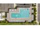 An aerial photograph of a community pool with ample seating and well-maintained landscaping at 13804 Woodbridge Ter, Lakewood Ranch, FL 34211