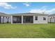 Rear exterior of house with screened-in patio offers indoor/outdoor living at 13804 Woodbridge Ter, Lakewood Ranch, FL 34211