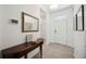 Bright foyer with console table and decorative mirror at 13804 Woodbridge Ter, Lakewood Ranch, FL 34211