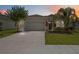 Charming home with a well manicured lawn and colorful landscaping at 13804 Woodbridge Ter, Lakewood Ranch, FL 34211