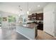 Open kitchen with a granite island and modern appliances at 13804 Woodbridge Ter, Lakewood Ranch, FL 34211