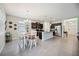 Kitchen with island, stainless appliances, granite counters and breakfast area near foyer at 13804 Woodbridge Ter, Lakewood Ranch, FL 34211