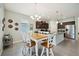 Open kitchen and breakfast area with an island, granite counters and stainless appliances at 13804 Woodbridge Ter, Lakewood Ranch, FL 34211