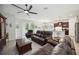 Spacious living room with tile flooring flowing into kitchen at 13804 Woodbridge Ter, Lakewood Ranch, FL 34211