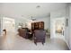 Spacious living room with tile flooring, dark furniture and ceiling fan at 13804 Woodbridge Ter, Lakewood Ranch, FL 34211