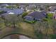 Aerial view of a landscaped backyard with a screened-in pool at 14901 17Th E Ave, Bradenton, FL 34212