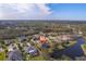 An aerial view of the neighborhood featuring lush greenery, lakes, and well-maintained homes at 14901 17Th E Ave, Bradenton, FL 34212