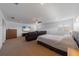 Spacious bedroom with a large television and comfortable seating area at 14901 17Th E Ave, Bradenton, FL 34212