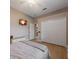 Comfortable bedroom with wood floors, tv, closet with white doors, and neutral decor at 14901 17Th E Ave, Bradenton, FL 34212