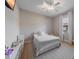 Cozy bedroom featuring a ceiling fan, natural light, and neutral decor at 14901 17Th E Ave, Bradenton, FL 34212