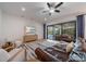 Bright living room showcasing a stylish ceiling fan and a sliding glass door leading to an outdoor area at 14901 17Th E Ave, Bradenton, FL 34212