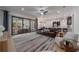 Open-concept living room with a clear view to the kitchen and a sliding glass door leading to the outside at 14901 17Th E Ave, Bradenton, FL 34212