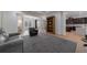 Open living area features hardwood floors, a stylish area rug, and seamless access to the home's entryway at 14901 17Th E Ave, Bradenton, FL 34212