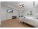 Bright main bedroom with a TV, ceiling fan, plantation shutters, and access to a balcony at 14901 17Th E Ave, Bradenton, FL 34212