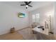 Bright office with a ceiling fan, plantation shutters, and a tv for entertainment at 14901 17Th E Ave, Bradenton, FL 34212