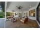 Expansive covered patio features ceiling fans, outdoor seating areas, and access to the pool and backyard at 14901 17Th E Ave, Bradenton, FL 34212