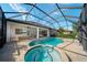 Sparkling pool and spa in screened enclosure, with ample patio space for outdoor entertaining and relaxation at 14901 17Th E Ave, Bradenton, FL 34212