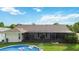 Image shows screened in lanai, backyard, and above ground pool at 1498 Truval Ter, Port Charlotte, FL 33952