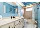 Bright bathroom featuring modern vanity, elegant mirror, and shower with coordinated fixtures at 1498 Truval Ter, Port Charlotte, FL 33952