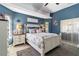 Beautiful main bedroom with stylish decor, vaulted ceilings, and bright natural light from the windows at 1498 Truval Ter, Port Charlotte, FL 33952