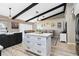 Bright open kitchen with a modern island, breakfast bar, and seamless flow into the adjacent living room at 1498 Truval Ter, Port Charlotte, FL 33952