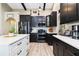 Well-equipped kitchen featuring stainless steel appliances and ample countertop space for cooking and entertaining at 1498 Truval Ter, Port Charlotte, FL 33952