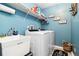 Laundry room with utility sink, and front loading washer and dryer at 1498 Truval Ter, Port Charlotte, FL 33952