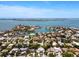 High angle aerial view highlights numerous residences and waterfront properties in a bay community setting at 1541 Flower Dr, Sarasota, FL 34239