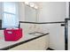 Well-lit bathroom with a tiled vanity, classic design, and ample counter space at 1541 Flower Dr, Sarasota, FL 34239