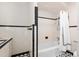 Clean bathroom features a shower-tub combo with classic black and white tiling at 1541 Flower Dr, Sarasota, FL 34239