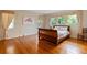 Spacious bedroom featuring hardwood floors, natural light, and ample closet space at 1541 Flower Dr, Sarasota, FL 34239