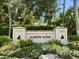 Welcome to Harbor Acres, a community entrance sign with greenery and manicured landscaping at 1541 Flower Dr, Sarasota, FL 34239