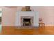 This beautifully crafted fireplace features marble accents and hardwood floors at 1541 Flower Dr, Sarasota, FL 34239