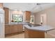 Bright kitchen features a center island with cooktop, eat-in space, and natural light at 1541 Flower Dr, Sarasota, FL 34239