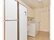 Functional laundry room with washer, dryer, ample counter space, and storage cabinets at 1541 Flower Dr, Sarasota, FL 34239