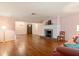 This spacious living room has hardwood floors and a fireplace, perfect for entertaining at 1541 Flower Dr, Sarasota, FL 34239